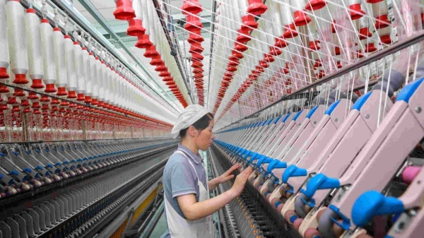 A worker at a texile factory in Nantong, in eastern China's Jiangsu province on September 14, 2023