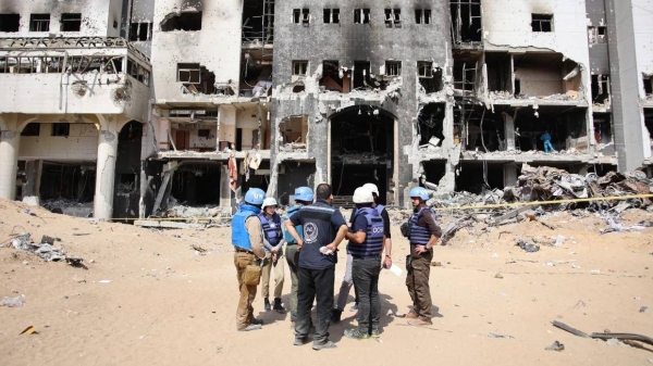 A United Nations team inspects the grounds of Al-Shifa hospital after an Israeli raid on April 8