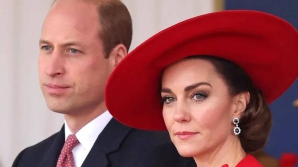 Prince William and Kate Middleton looking into the distance. — courtesy PA Media