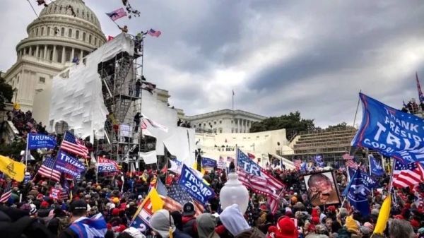Trump supporters clash with police and security forces as people try to storm the US Capitol on January 6, 2021 in Washington, DC. — courtesy Brent Stirton