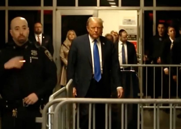 Donald Trump walks into the Manhattan court during his hush-money trial on Tuesday.