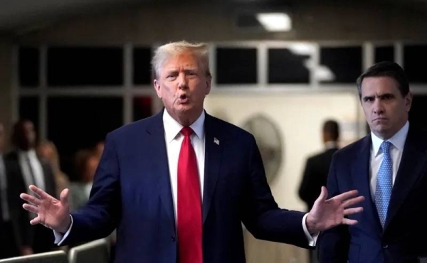 Donald Trump outside a New York court talking to press. — courtesy Timothy A. Clary