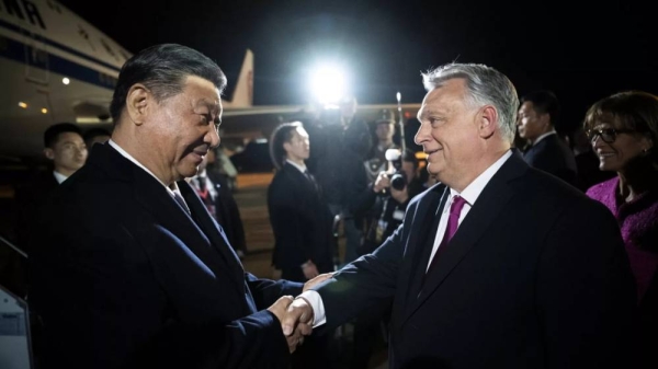 Chinese President Xi Jinping, left, shakes hands with Hungarian Prime Minister Viktor Orban