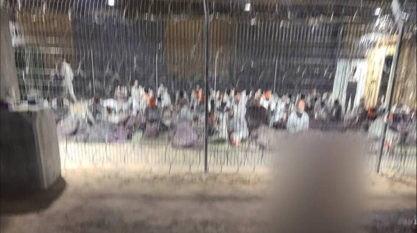 A leaked photograph of an enclosure where detainees in gray tracksuits are seen blindfolded and sitting on paper-thin mattresses. CNN was able to geolocate the hangar in the Sde Teiman facility