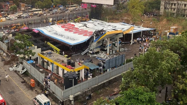 The billboard fell onto a fuel station following a wind and dust storm in Mumbai, India, on May 13, 2024