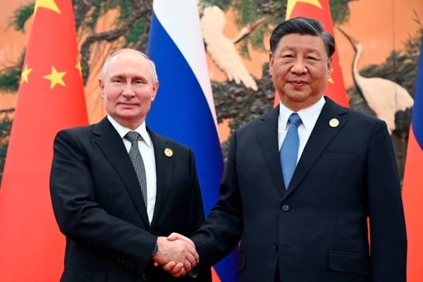 Chinese President Xi Jinping, right, and Russian President Vladimir Putin pose for a photo prior to their talks on the sidelines of the Belt and Road Forum in Beijing, China, on Wednesday, Oct. 18, 2023