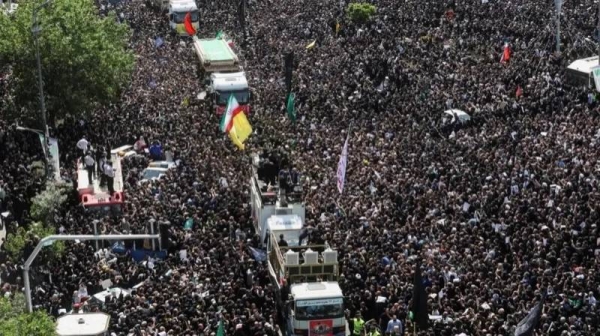 Thousands of mourners attend the procession on Wednesday