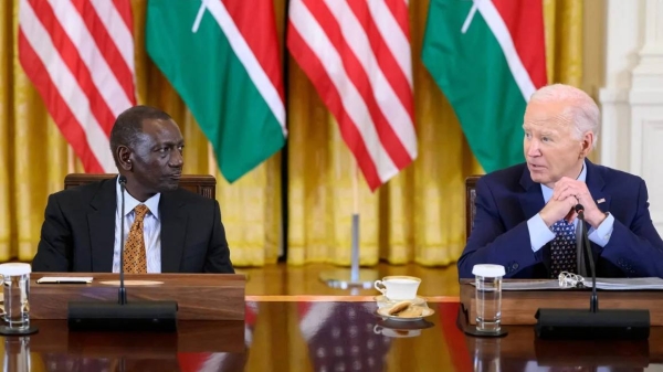 US President Joe Biden, right, and Kenya's President William Ruto, left, take part in an event with CEOs and business leaders in the East Room of the White House in Washington, DC, on May 22, 2024