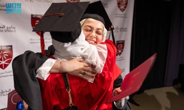Two Saudi female graduates share their joy during the graduation ceremony held at the Harvard Medical School in Boston on Friday.
