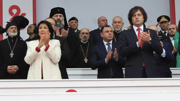 President Salome Zourabichvili, left, and Prime Minister Irakli Kobakhidze, right, attend a celebration for Independence Day in Tbilisi, May 26