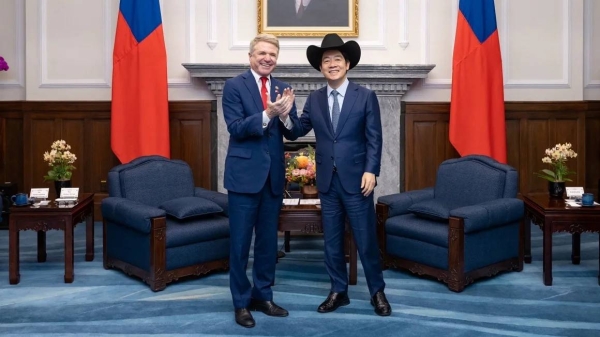 Taiwan President Lai Ching-te (right) wears a cowboy hat given to him by US Representative Michael McCaul, chairman of the House Foreign Affairs Committee, at the presidential office in Taipei on May 27, 2024