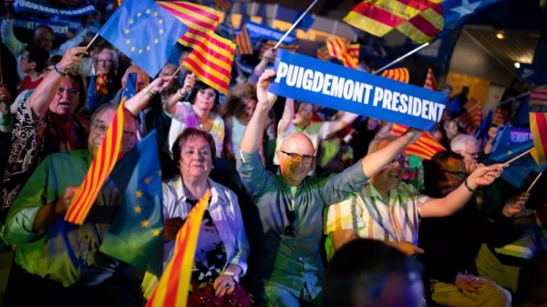 Supporters of exiled Catalonian former regional president Carles Puigdemont at a campaign rally in Argelers, France