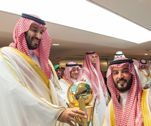 Crown Prince Mohammed bin Salman hands the King’s Cup to Al Hilal’s president Fahad bin Nafel.