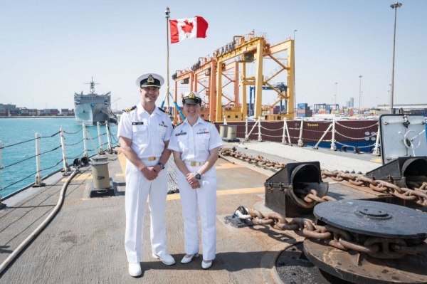 Commander Travis Bain and Lieutenant (Navy) Melanie Weaver on board of HMCS Montréal.