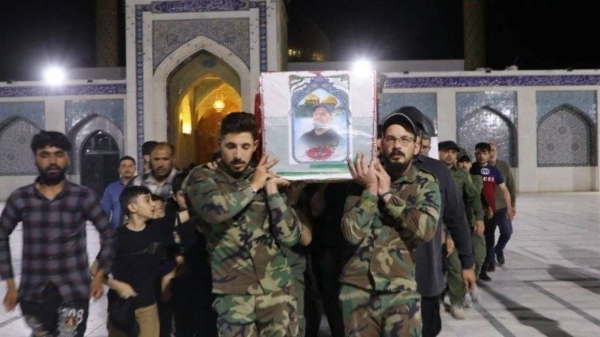 Mourners carry the coffin of Saeed Abiyar, an Iranian millitary adviser, reportedly killed Monday