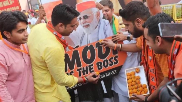 Bharatiya Janata Party (BJP) supporters celebrate after Indian prime minister claimed their party's victory in the election results at the BJP headquarters in New Delhi