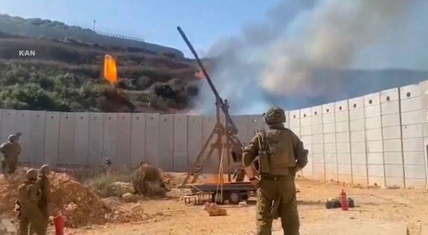 Israeli soldiers catapult fireball into Lebanon