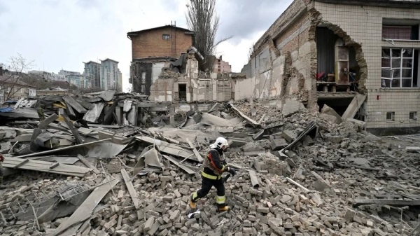 A Ukrainian rescuer works at the site of a missile attack in Kyiv, Ukraine on March 25, 2024