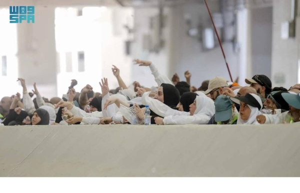 Pilgrims perform stoning ritual at Jamarat on the second day on Monday.