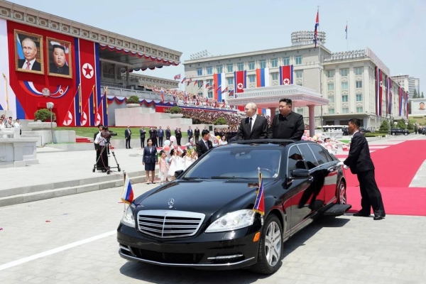 North Korean leader Kim Jong Un and Russian President Vladimir Putin exit a welcome ceremony at Kim Il Sung square in Pyongyang on June 19