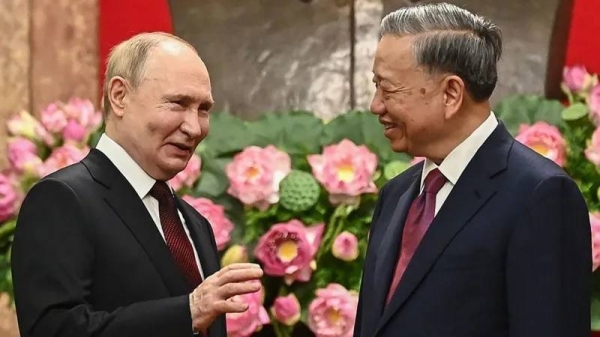 Vladimir Putin (left) met Vietnamese President To Lam as he began a state visit to Vietnam on Thursday