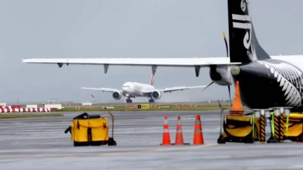 An Emirates plane touches down at Auckland International Airport