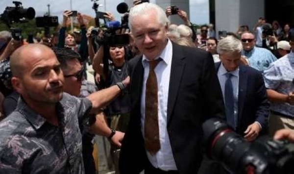A videograb shows WikiLeaks founder Julian Assange leaving the US Federal Courthouse in Saipan, Northern Mariana Islands, on Wednesday.