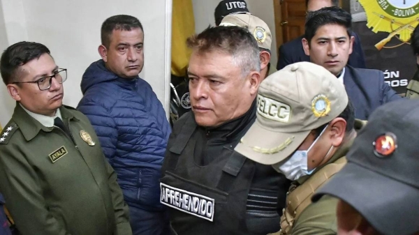 Now-dismissed Bolivian army chief General Juan Jose Zúñiga is escorted by policemen following his arrest in La Paz, on June 26, 2024