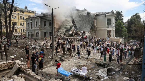 Rescuers work at Kyiv's Okhmatdyt hospital, which was damaged in a Russian missile strike on Monday morning