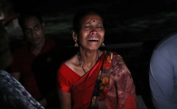 Family members of stampede victims mourn outside a hospital in Hathras, Uttar Pradesh