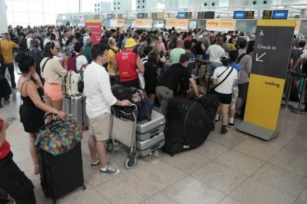 There were long lines at Barcelona airport, as passengers waited to be checked in manually