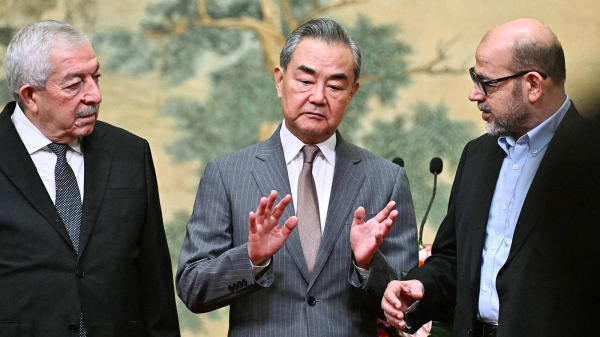 Mahmoud al-Aloul, Vice Chairman of the Central Committee of Fatah, China's Foreign Minister Wang Yi, and Mussa Abu Marzuk, a senior member of Hamas, in Beijing on July 23, 2024