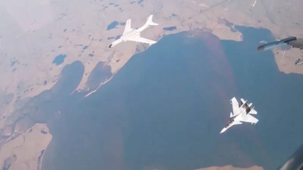 A Chinese H-6K bomber and a Russian Sukhoi Su-30CM jet fighter during Wednesday's patrol near Alaska