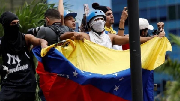 Venezuelans have been gathering in central Caracas for a second day