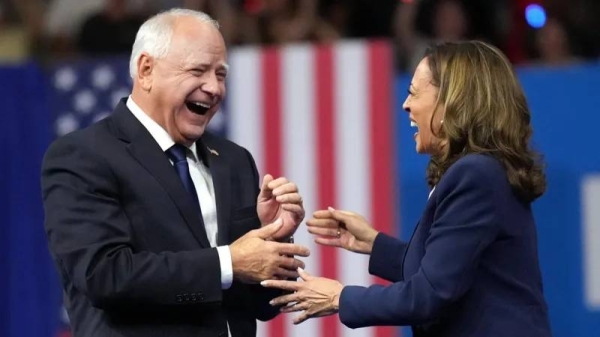 Kamala Harris and Tim Walz share a light moment