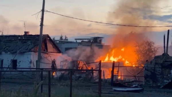 A building burns in the Russian town of Sudzha following Ukraine's incursion into Kursk region, August 7, 2024