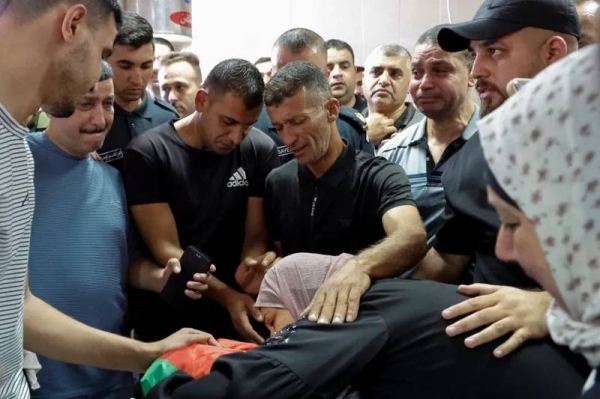 Palestinians mourn Abdel Nasser during his funeral on 24 July