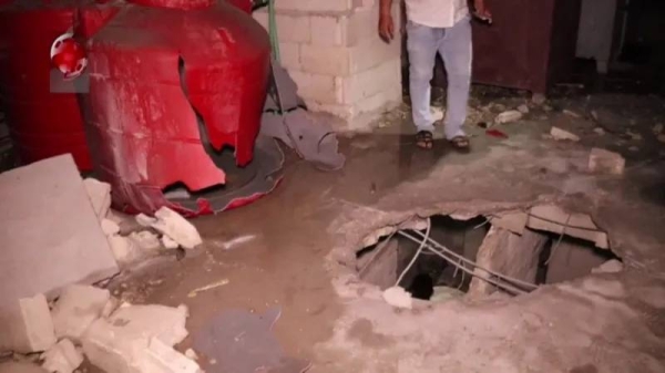 Syrian state-run Al-Ikhbariya al-Suriyah TV broadcast footage purportedly showing a damaged building in the port city of Tartous, west of Masyaf