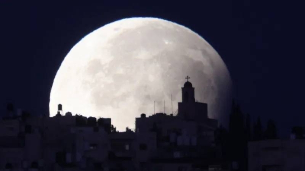 The supermoon with a partial lunar eclipse was seen around the world - with this picture taken from Jerusalem