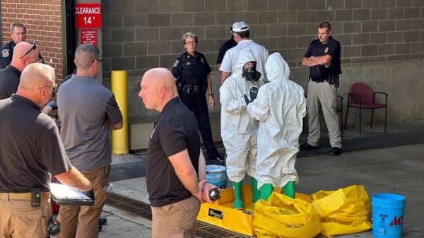 A hazmat crew from the National Guard's Civilian Support Team investigates after a suspicious package was delivered to election officials at the Missouri Secretary of State's Jefferson City office on Tuesday