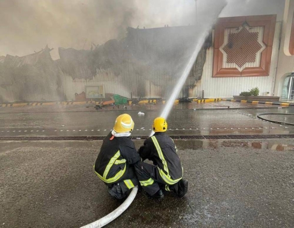 Civil Defense personnel battle the blaze that swept through Jeddah International Market on Sunday.