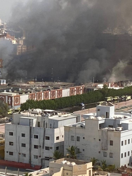 Civil Defense personnel battle the blaze that swept through Jeddah International Market on Sunday.