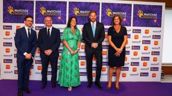 Prince Harry poses for a picture with General Manager at Royal Lancaster Hotel Sally Beck, WellChild CEO Matt James, WellChild Chair of Trustees Craig Hatch,