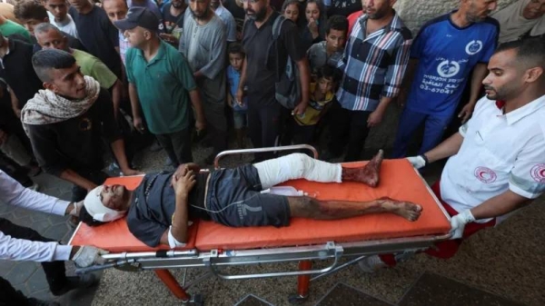 Casualties are being brought to al-Aqsa hospital after the air strike
