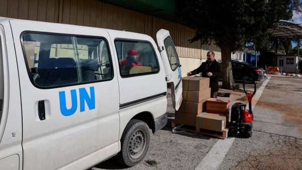 UNRWA workers transport boxes of humanitarian aid at the West Bank field office complex of UNRWA, in the Sheikh Jarrah neighborhood of East Jerusalem, on January 30, 2024