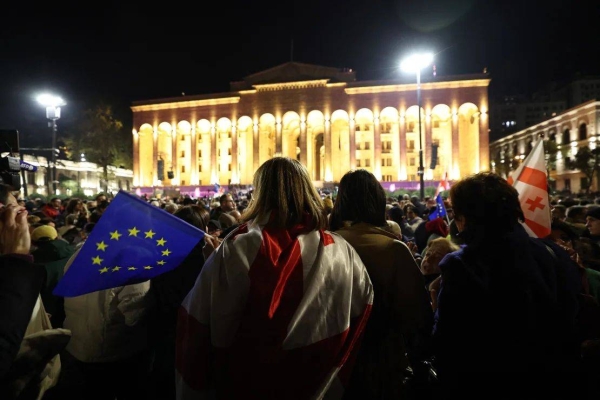 Georgian opposition supporters rally outside the parliament in Tbilisi on Monday