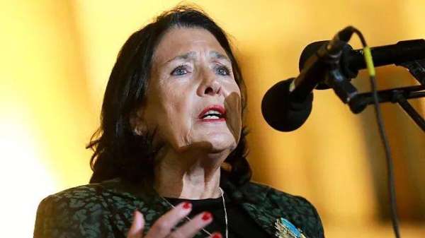 Georgian President Salome Zourabichvili speaks to a crowd during an opposition protest against the results of the parliamentary election in Tbilisi, Georgia