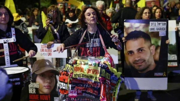 Relatives of hostages and their supporters demonstrate by Netanyahu's residence