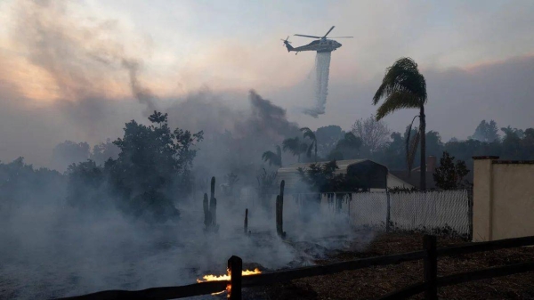 Californians desperately flee their homes amid raging wildfires