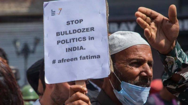 A man takes part in protest after Indian authorities demolished the house of activist Afreen Fatima and his father Javeed Mohammad in 2022